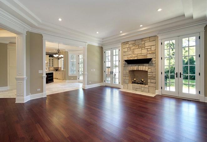 gleaming wood flooring in a spacious open-concept kitchen